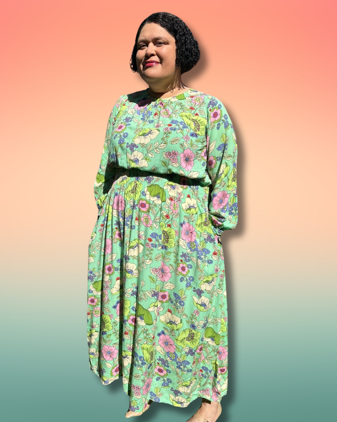 Woman wearing a floral dress on a gradient background